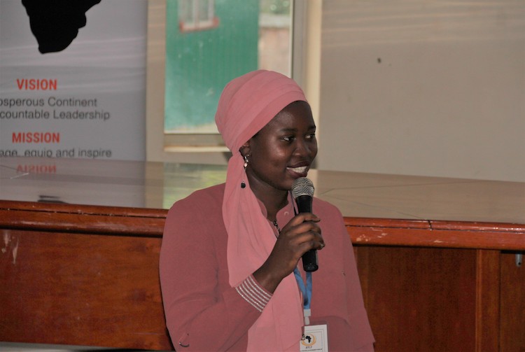 A young woman leading a talk on important issues.